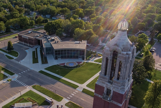 Aerial photo of the Coughlin Campanile with the SDSU Alumni & Foundation building in the background.