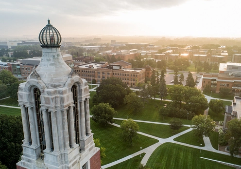Aerial photo of the Coughlin Campanile with campus in the background.