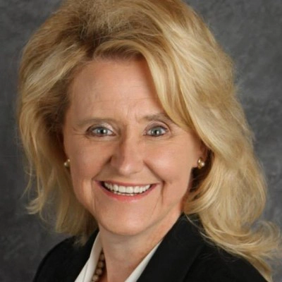 A professional headshot photo of Debra Muller.