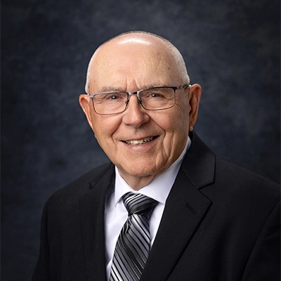 A professional headshot photo of Doug Hofer.