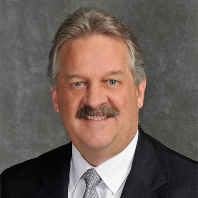 A professional headshot photo of Kevin Haarberg.