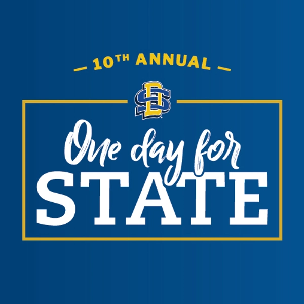 Blue background with the One Day for STATE logo overlayed on top.