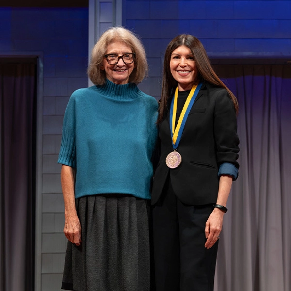 New endowed faculty member smiles while standing next to the donor who started the endowment.