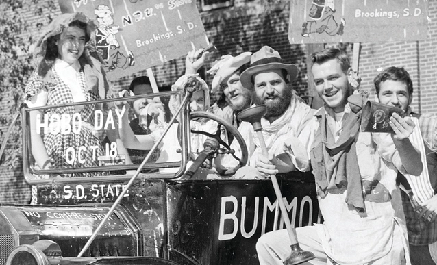 Historic photo of the Bummobile and hobo day committee members.
