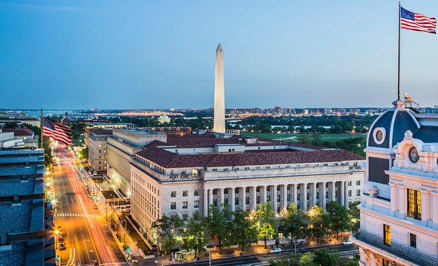 Aerial view of the National Press Building with the Washington Monument in the background.