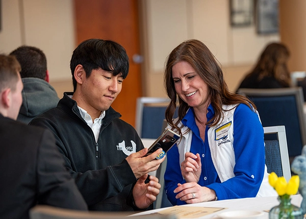 A SDSU mentor with her SDSU student mentee at a mentor event at the SDSU Alumni Center.
