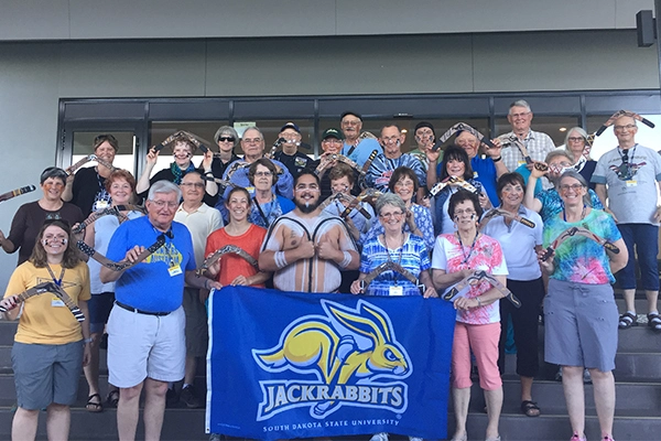 A large group of Jackrabbits traveling together pose for a group photo in Australia.