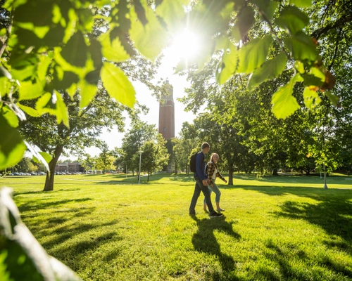 Two students walking near the Campanile