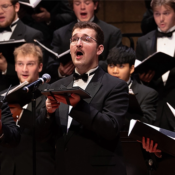 Charles Kriech sings passionately in a choir