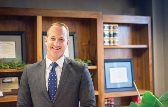 A gentleman standing in an office