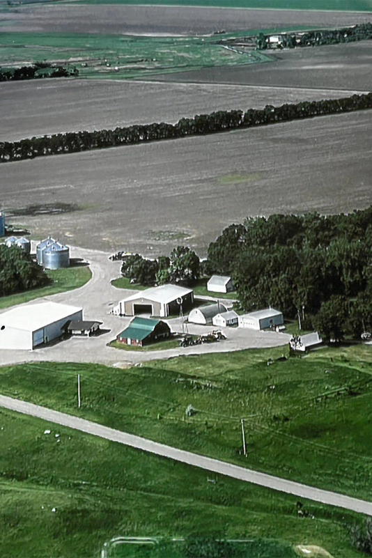 Overview of a house and farm land