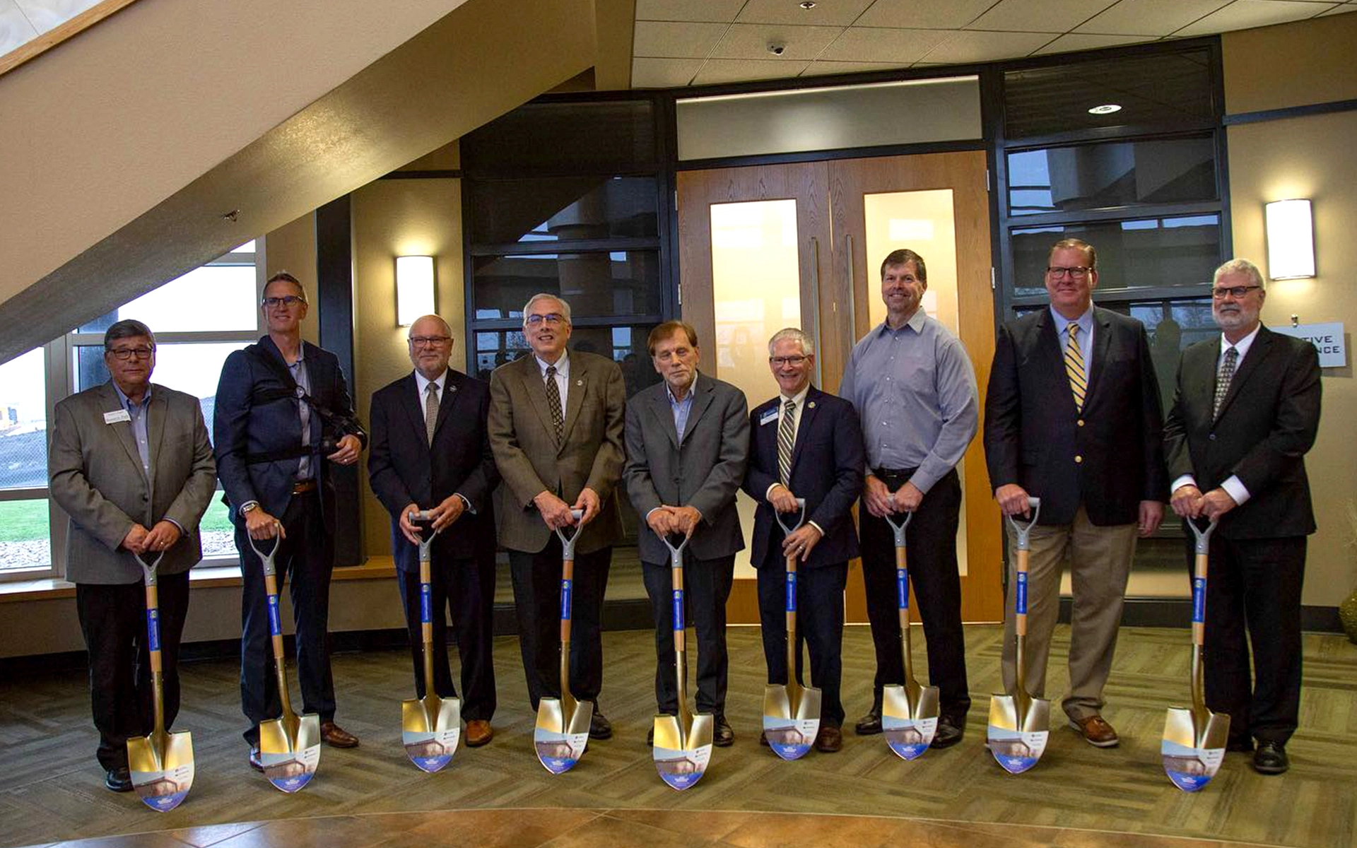 Group photo of people with shovels in their hands, taken at the groundbreaking of the POET Bioprocessing Institute. L to R: Dwaine Chapel, Jeff Lautt, Jim Rankin, Barry Dunn, David Salem, Daniel Scholl, Kevin Tetzlaff, Jeff Partridge, Ralph Davis