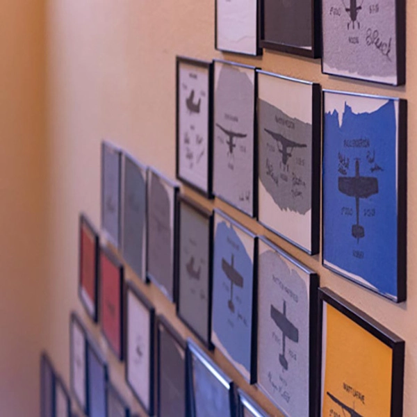 Framed "shirt tails" hanging on a wall