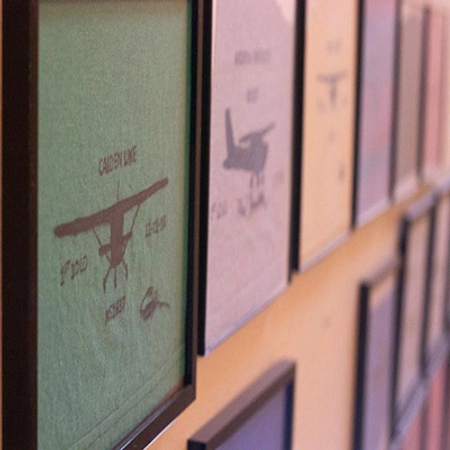 Close up image of aviation "shirt tails" framed on a wall