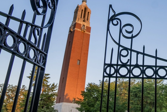Coughlin Campanile in the background framed by the Sylvan Theatre gates