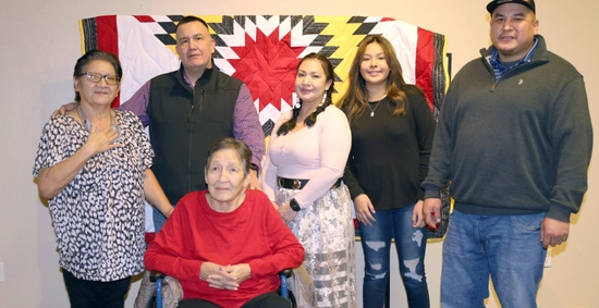 Anna Jealous of Him surrounded by her family at her honor ceremony