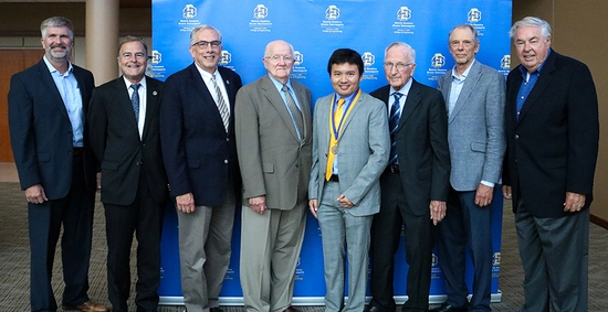 Reece Kurtenbach, Dean Berdanier, President Barry Dunn, Duane Sander, Dr. Liu, Al Kurtenbach, Jim Morgan, and Jerry Lohr smile together after the investiture ceremony.