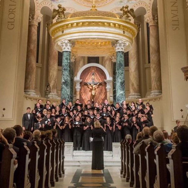 Dr. Diddle directs the choir in a beautiful cathedral.