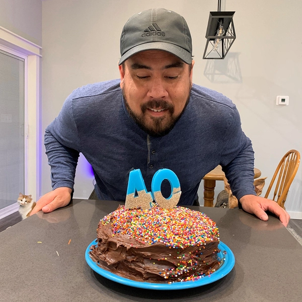 Don blowing out his "40" candles on his birthday cake