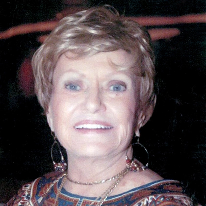Close up image of Maxine Wilcox smiling at the camera
