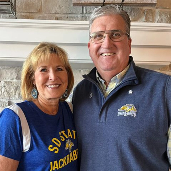 Jerome and Elaine Garry smiling wearing Jackrabbit gear