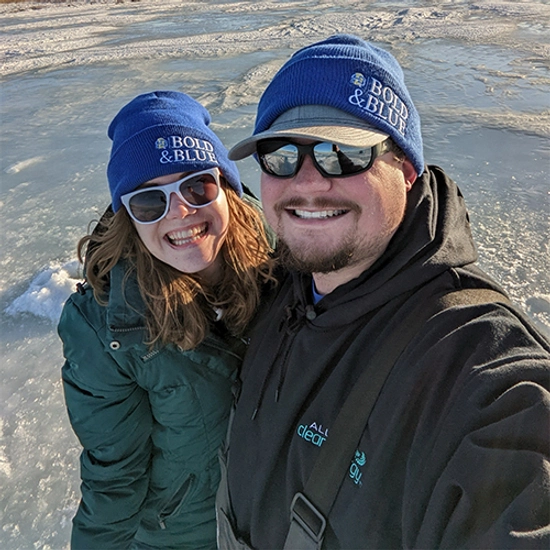 A couple pose for a selfie while outside in the snow
