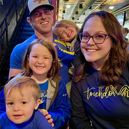 Holly with her husband and their three children in jackrabbit gear