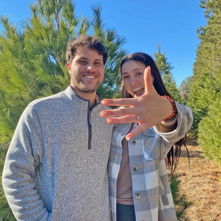 Jordan with her husband showing her engagement ring