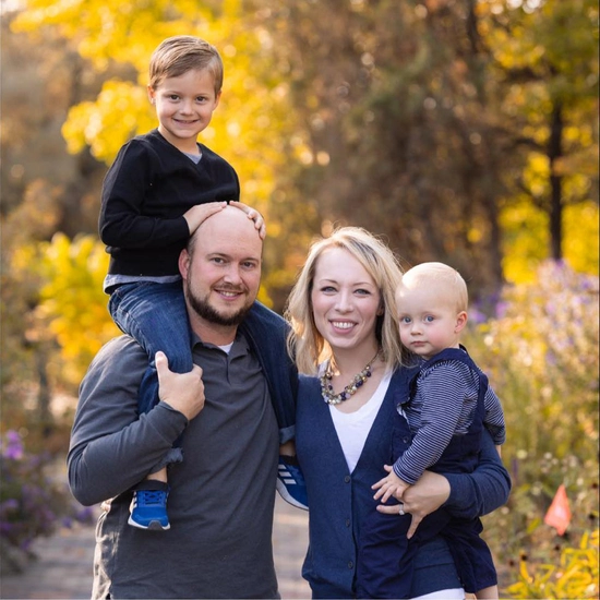Maggie with her husband and two sons