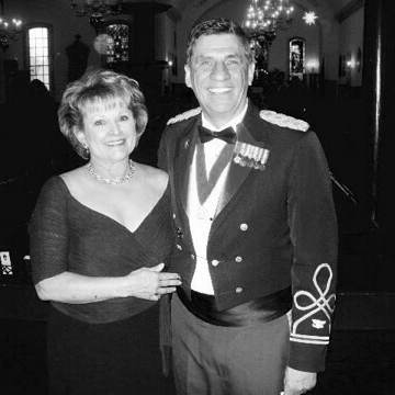 black and white photo of a married couple, the man dressed in a military uniform