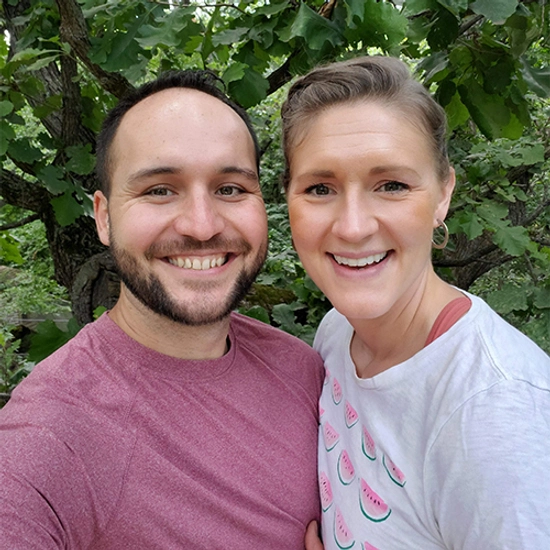 Rachel smiles with her husband