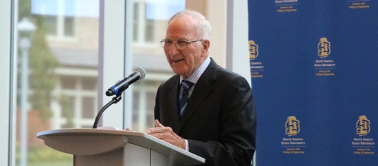 Al Kurtenbach speaks at an investiture ceremony