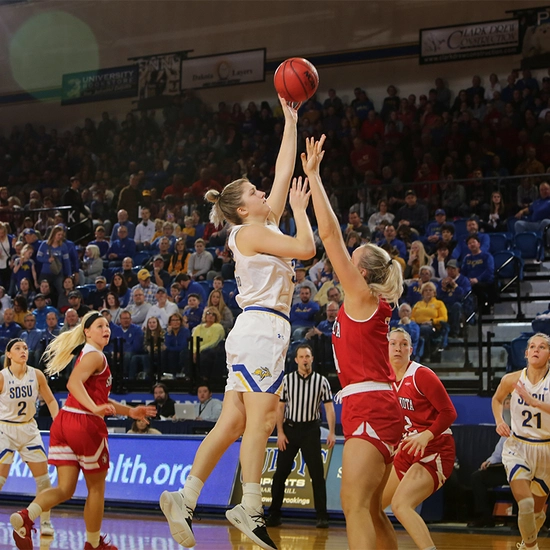 payton burckhard shoots a basketball during a game