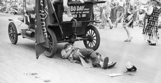 historic photo of the bummobile and someone laying under it