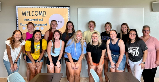 One of the first classes for the new elementary education and special education programs at SDSU. The group of 14 smile for the camera.