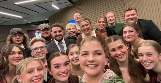 members of the sdsu choir and theatre group smiling after a performance