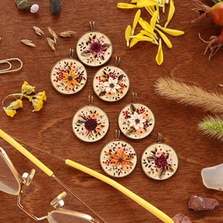 close up image of 8 earth clay necklaces