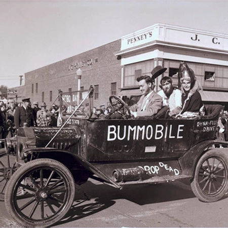 historic photo of the bummobile during a hobo day parade
