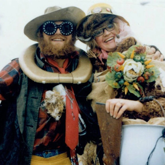 Weary Wil and Dirty Lil pose for the photo while wearing hats and glasses