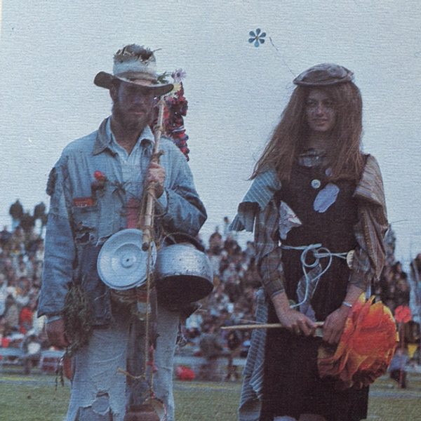 The original photo of Weary Wil and Dirty Lil at the football game