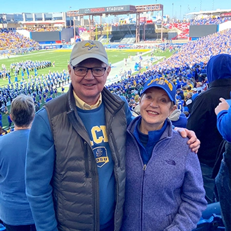 A couple at a SDSU football game