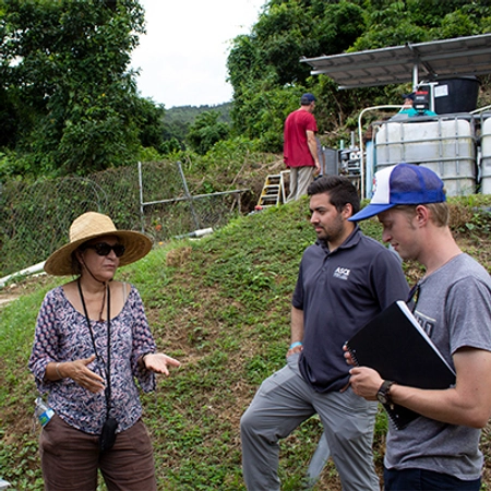 Luis listening a woman talk