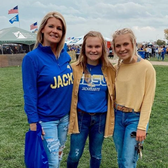 maddie fitch with her mom and sister at football tailgating