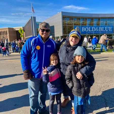 Micheal with his family in front of the Foundation Building