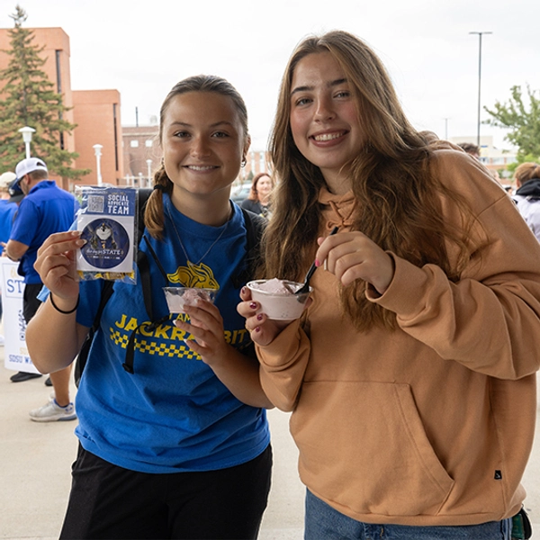 South Dakota State University students pose with SDSU Ice Cream during One Day for STATE
