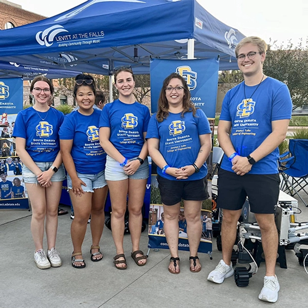 Hailey Gruber stands with other members of the Lohr College of Engineering at the Levitt at the Falls event.