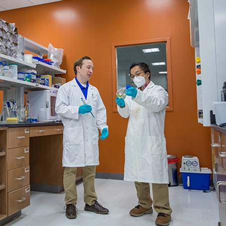 Students collaborating in a lab setting within the Raven Precision Agriculture Center.