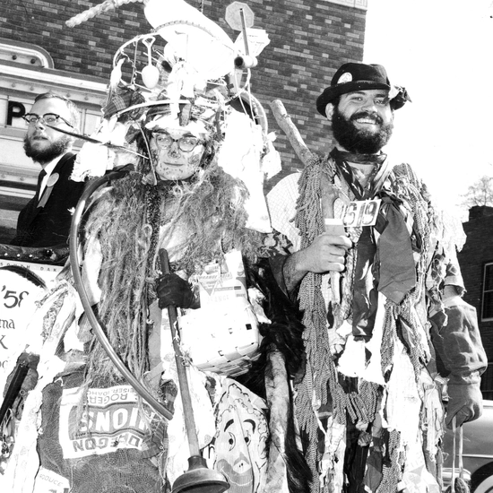 Historic photo of the hobo day king and queen dressed in full hobo gear