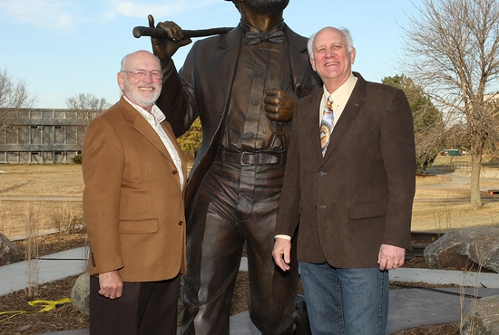 David Blegen and David Anderson smile with the Weary Wil statue after the dedication in 2011.