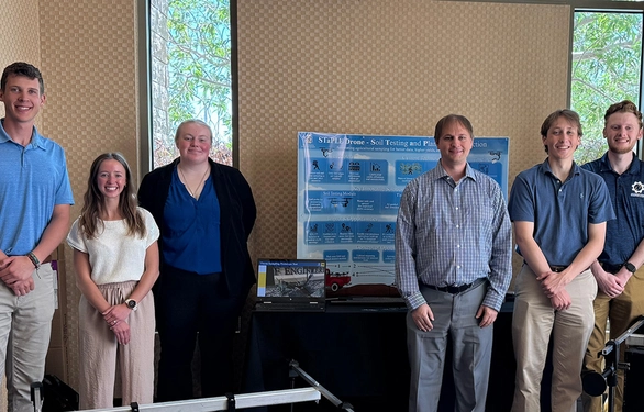Members of SDSU’s entry in NASA’s Gateways to Blue Skies competition pose with the prototypes of the ag drone modules they built.
